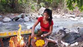 Survival cooking in forest - Duck egg spicy delicious grilled in bamboo tree for dinner