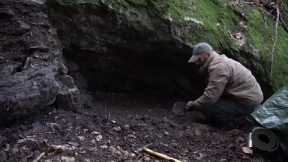 Four excavated shelter.Building underground bunker.Earth hut. primitive technology.Clay stone oven