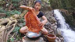 Pork ribs grilled spicy delicious for dinner near waterfall - Survival cooking in jungle