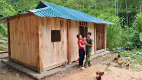 Building a wooden house with his wife - wooden plank construction, farm life