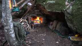 Excavate a natural shelter. Stone fireplace with chimney. Sleeping in the wild. Survival skills