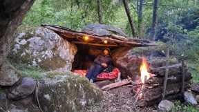 Bushcraft camping, building a survival shelter in the wilderness